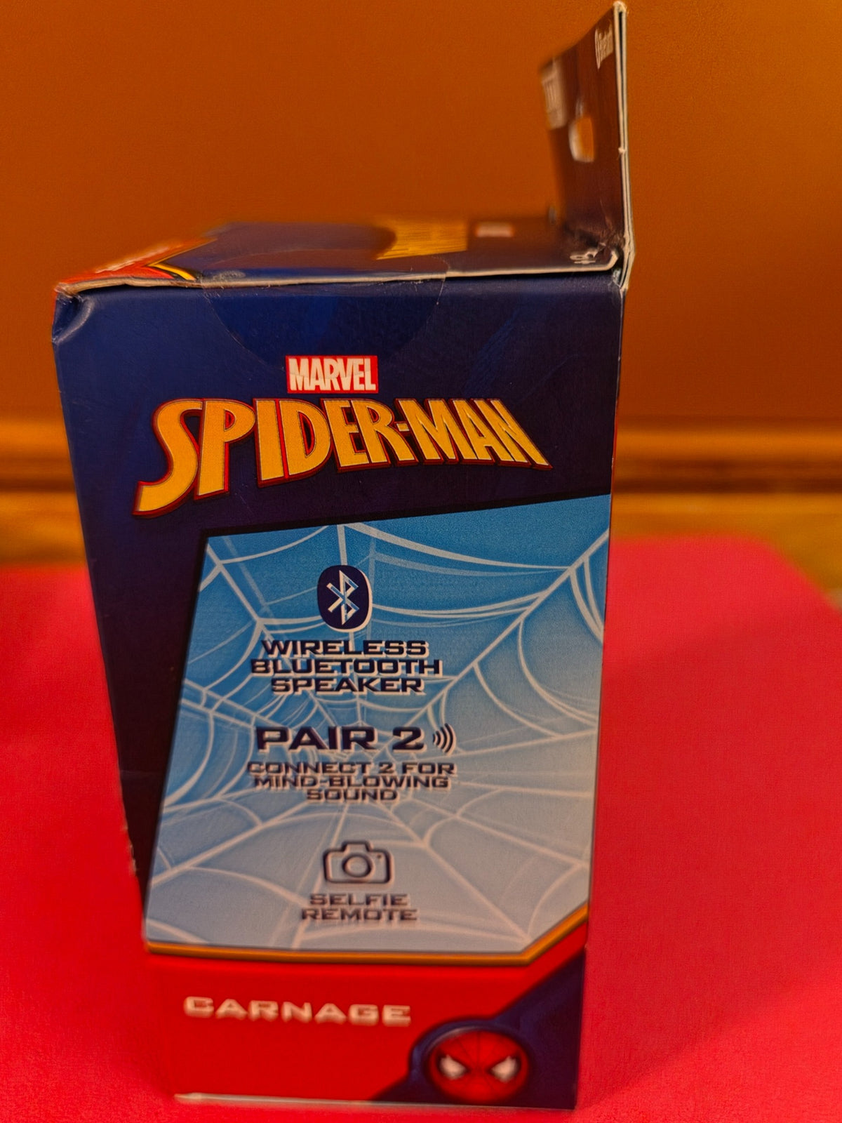 Side view of Marvel Spider-Man Carnage Bitty Boomers Bluetooth speaker box
