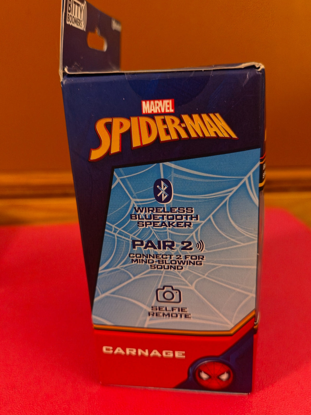 Opposite side view of Marvel Spider-Man Carnage Bitty Boomers Bluetooth speaker box