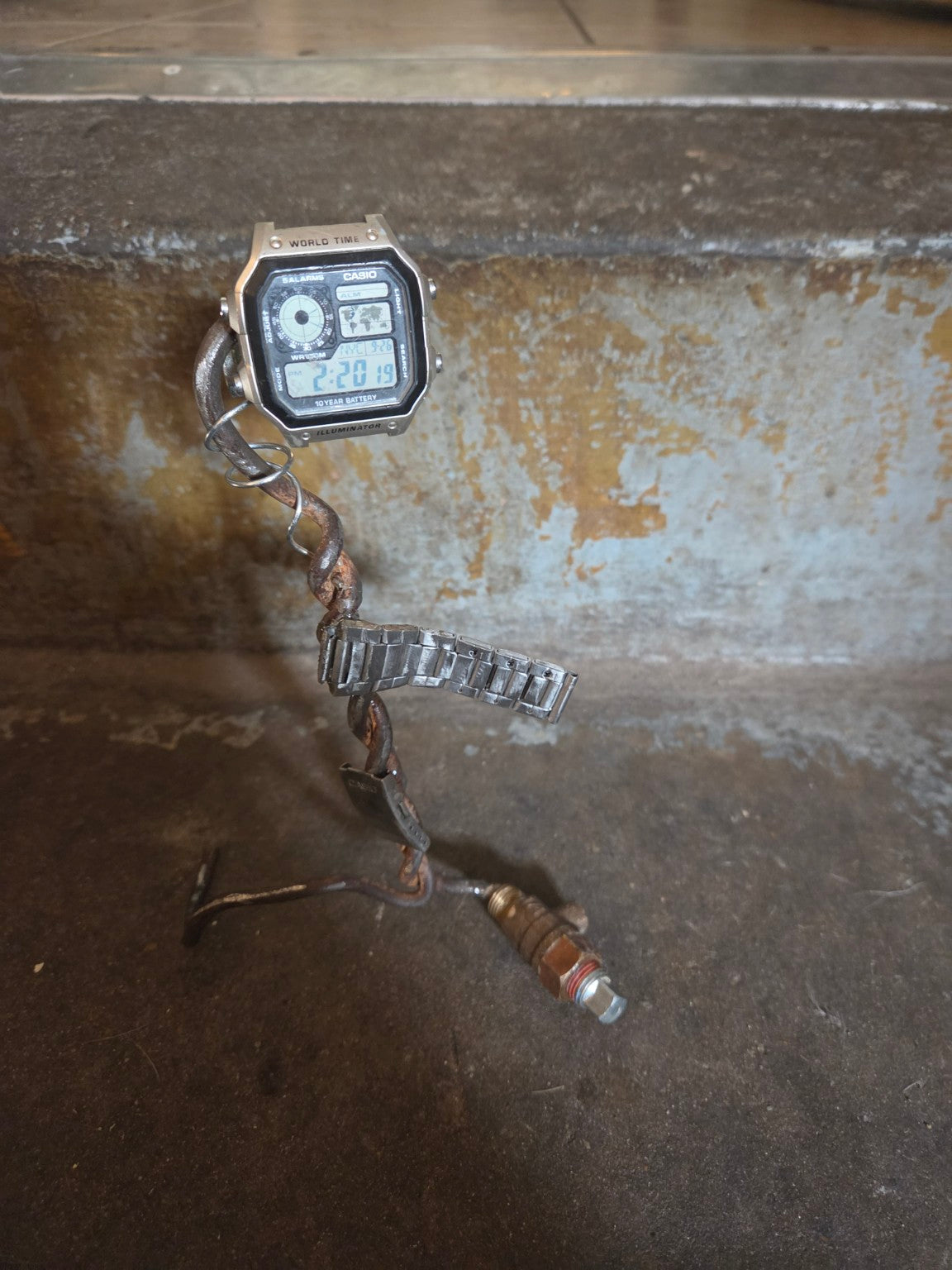 Actual handmade industrial watch sculpture front view with Casio watch included