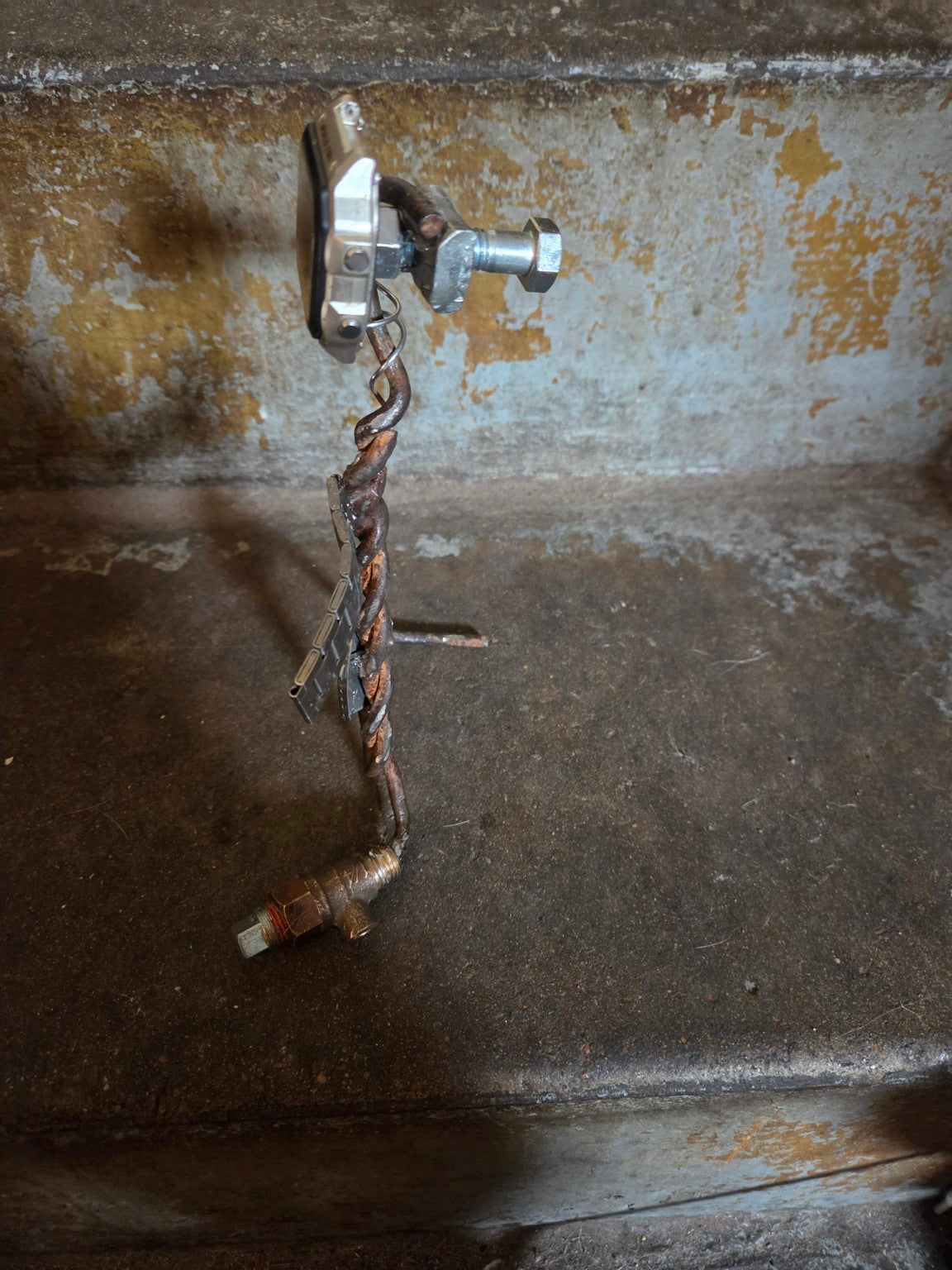 Handmade industrial watch sculpture side view